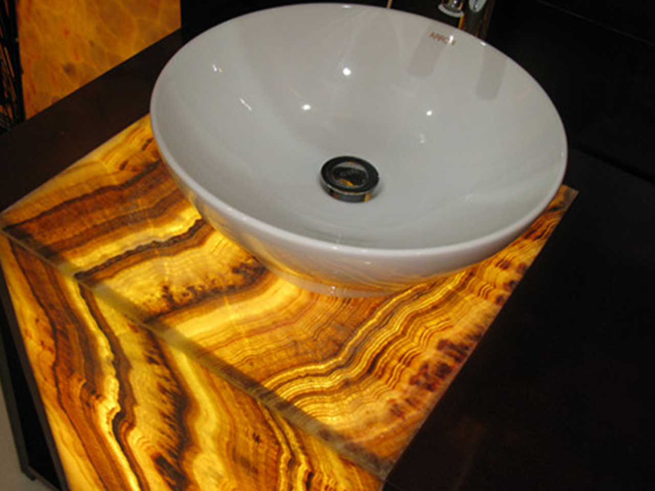 Backlit honey onyx vanity in a healthcare interior